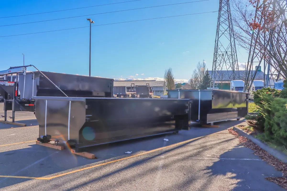 Roll-off dumpster ready for waste disposal at job site for 12 Yard Dumpster Rental in Grambling